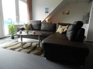 Wohnzimmer mit Ledersofa, Ferienwohnug Wattenläufer in Dorum bei Bremerhaven